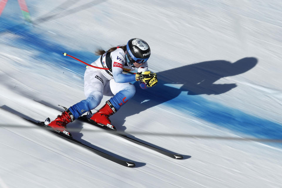 United States' Breezy Johnson speeds down the course during an alpine ski, women's World Cup downhill training, in Cortina d'Ampezzo, Italy, Friday, Jan. 21, 2022. (AP Photo/Gabriele Facciotti)