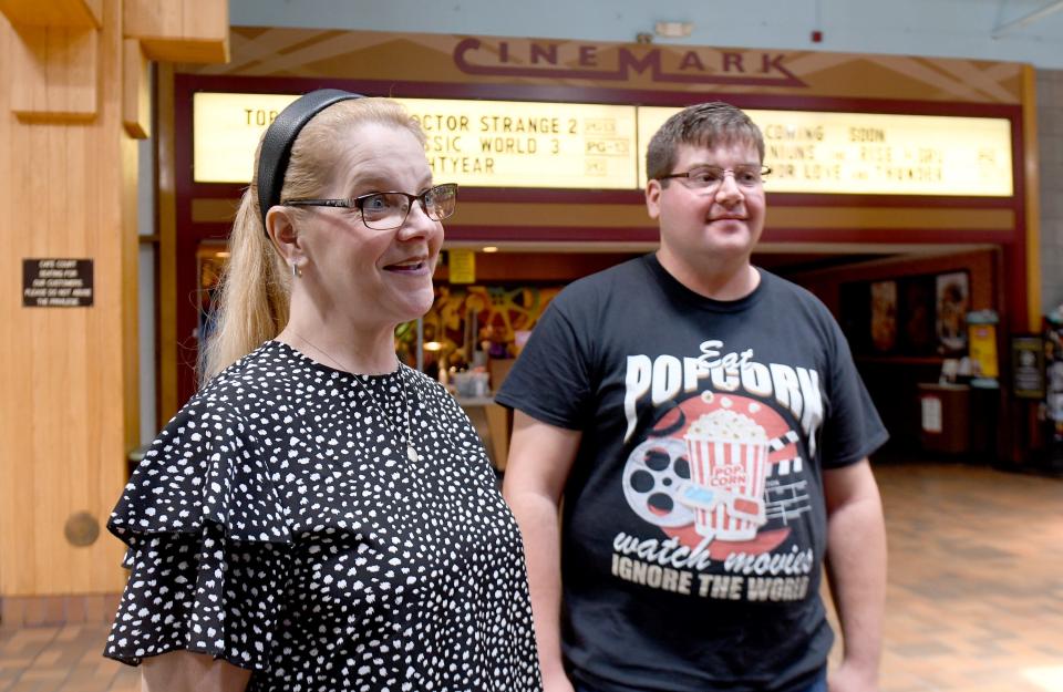 Garrett Ball of Beloit, with his mom Kelley Moffett, want the Cinemark theater saved in some capacity, as officials plan to redevelop Carnation Mall.