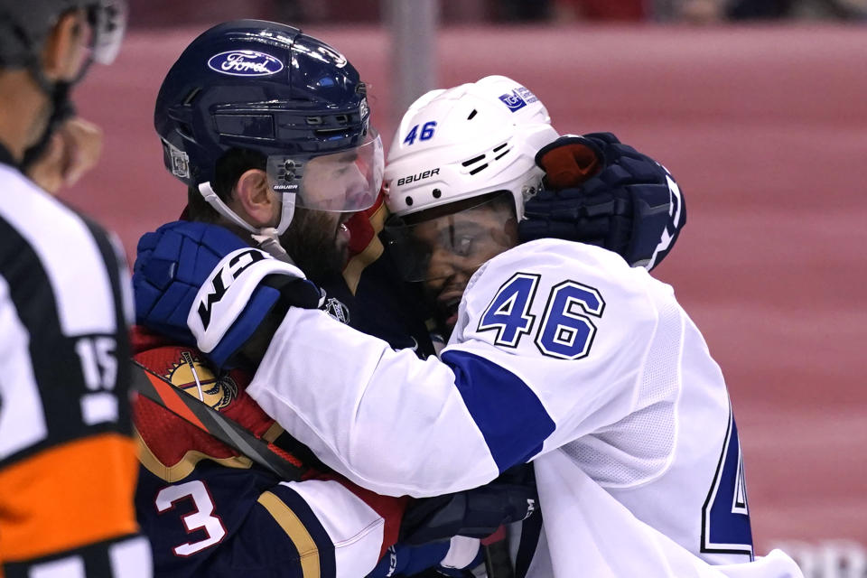 Florida Panthers defenseman Keith Yandle (3) and Tampa Bay Lightning center Gemel Smith (46) fight during the third period of an NHL hockey game, Saturday, Feb. 13, 2021, in Sunrise, Fla. (AP Photo/Lynne Sladky)