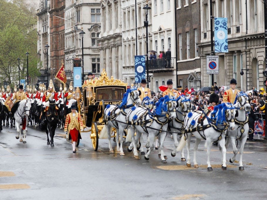 King Charles III and Camilla, Queen Consort approach Westminster Abbey for the coronation.