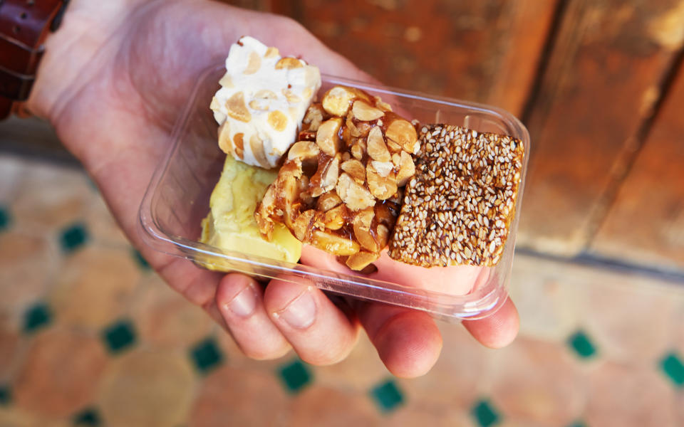 <p>Wandering through the streets of Fez, you might pass a few candy vendors selling nougat, a chewy treat that can be made with sesame seeds, peanuts, and almonds.</p>