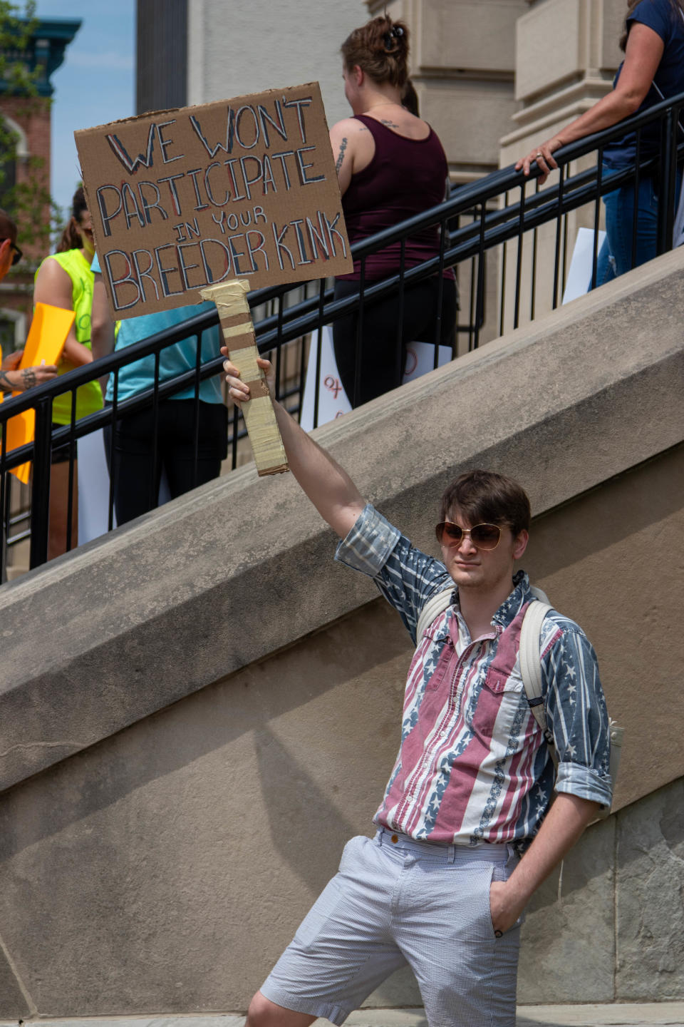 Outside of the Tippecanoe County Courthouse, a protester demonstrates as part of the nationwide "Bans Off Our Bodies" protest against the potential Supreme Court decision that would overturn Roe v. Wade, on May 14, 2022, in Lafayette. "We won't participate in your breeder kink," reads the sign.