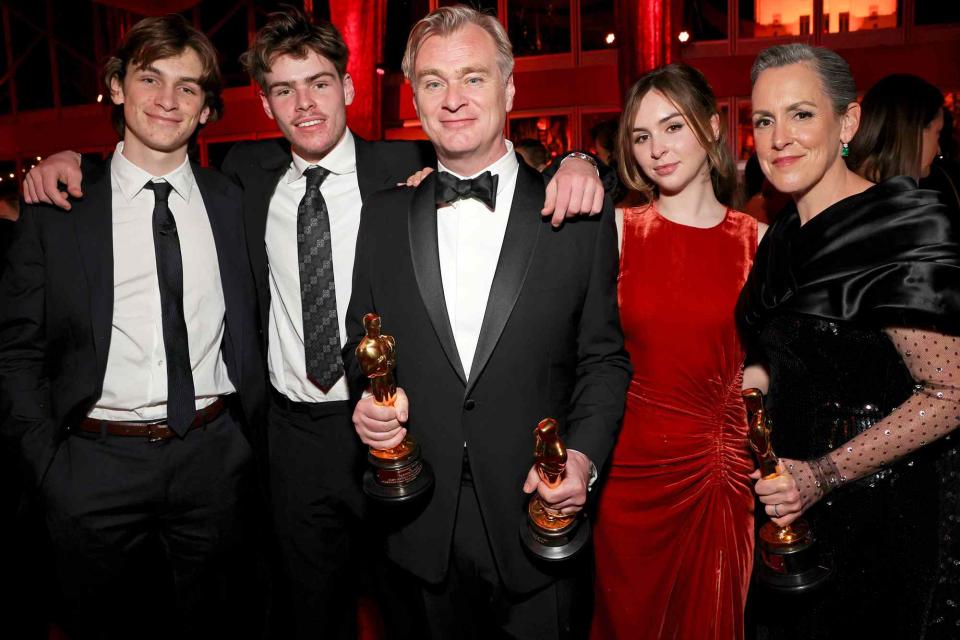 <p>Kevin Mazur/VF24/WireImage for Vanity Fair</p> Christopher Nolan (center), Emma Thomas (right) and their children on March 10, 2024