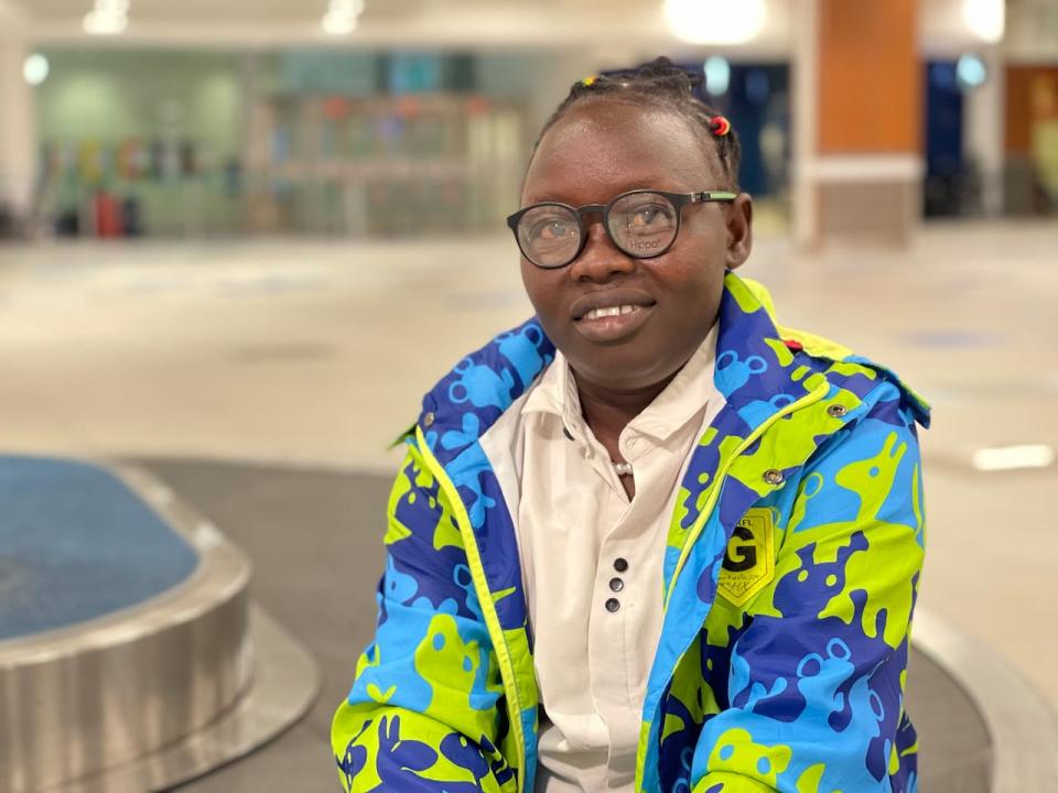 Patricia Kamssor, a former refugee, at Halifax Stanfield International Airport. She has been hired by MacLeod Group Health Services to be a continuing care assistant at a nursing home in Mahone Bay, N.S. 