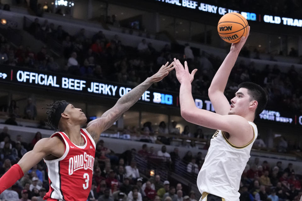 Purdue's Zach Edey (15) shoots over Ohio State's Eugene Brown III (3) during the second half of an NCAA semifinal basketball game at the Big Ten men's tournament, Saturday, March 11, 2023, in Chicago. (AP Photo/Charles Rex Arbogast)