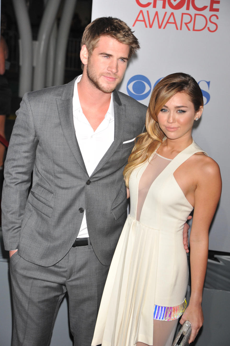 Singer Miley Cyrus and actor Liam Hemsworth arrive at the People's Choice Awards 2012 held at Nokia Theater L.A. Live in Los Angeles.