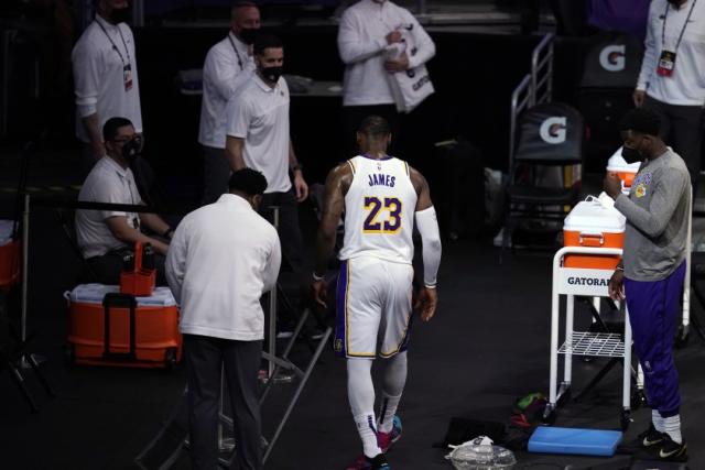 LeBron James limps off floor with injury as Lakers season hits new low