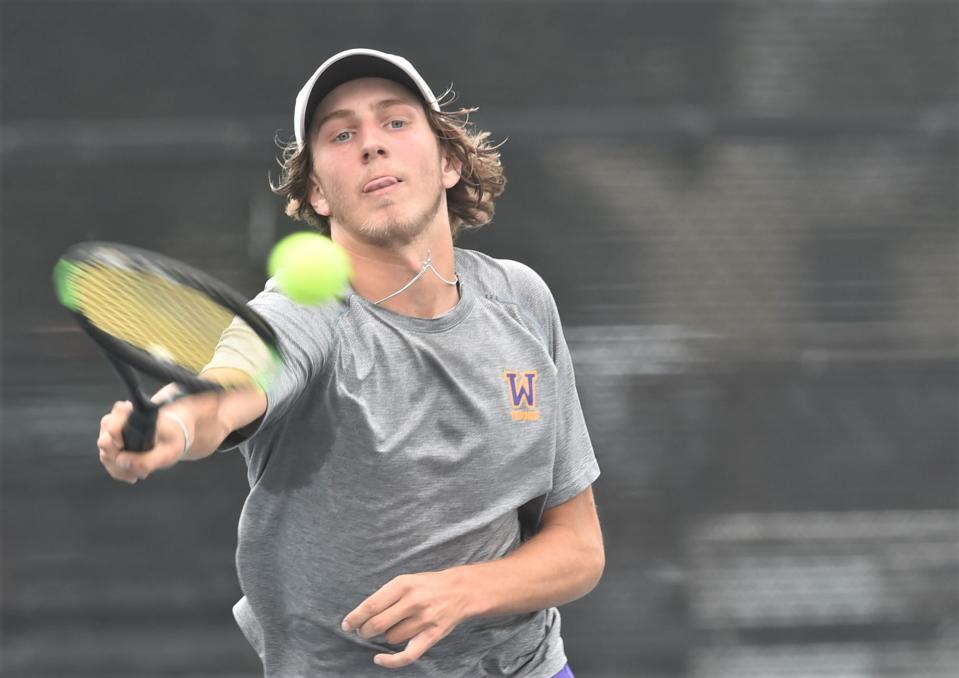 Wylie's Marshall McPherson reaches for a shot in his mixed doubles match against McAllen Memorial's Diego Salvo and Dania Casas. The McAllen team won 6-2, 6-3 over McPherson and Carly Bontke in the state quarterfinals at the Class 5A state tournament Tuesday at Northside Tennis Center in Helotes.