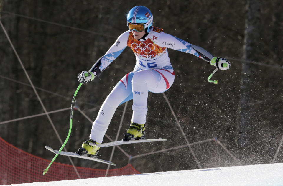 Austria's Nicole Hosp jumps in the women's super-G at the Sochi 2014 Winter Olympics, Saturday, Feb. 15, 2014, in Krasnaya Polyana, Russia. (AP Photo/Charles Krupa)