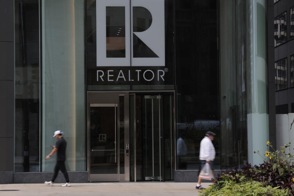People walk past the National Association of Realtors building at 430 N. Michigan Ave. in Chicago on Sept. 20, 2023. (Antonio Perez/Chicago Tribune/Tribune News Service via Getty Images)