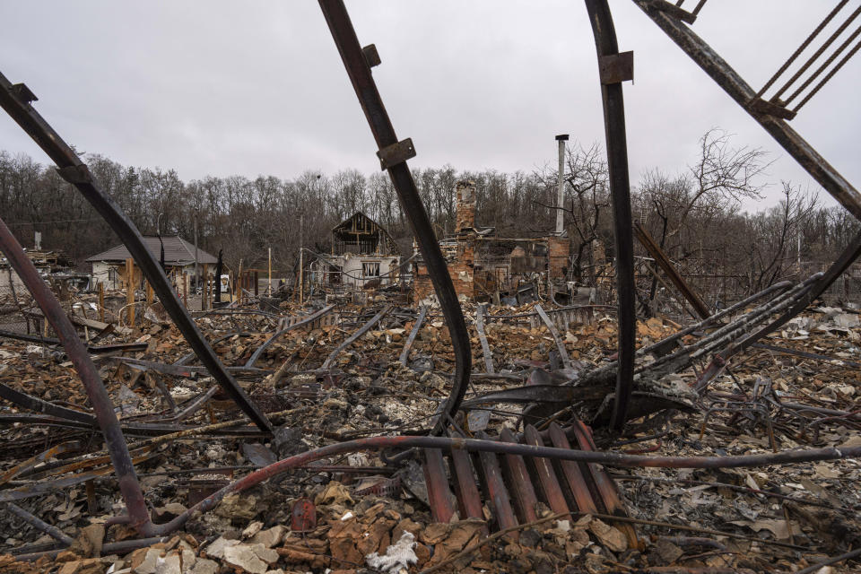 A view of houses destroyed by Russian forces' shelling in the outskirts of Chernihiv, Ukraine, Wednesday, April 13, 2022. (AP Photo/Evgeniy Maloletka)