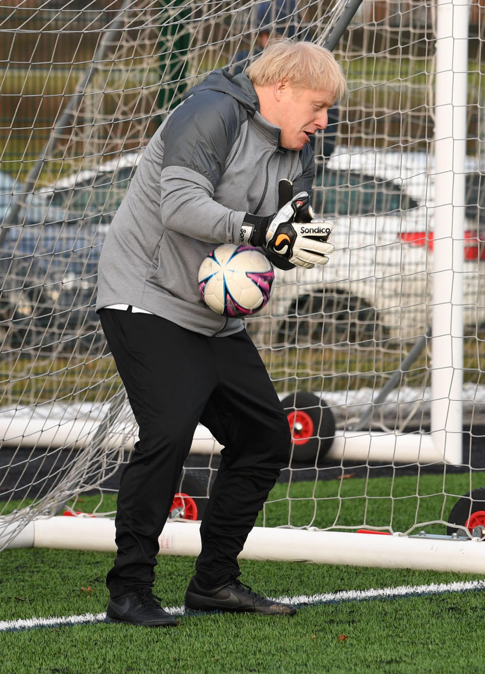 Prime Minister Boris Johnson tries his hand in goal before a football match between Hazel Grove Utd and Poynton Jnr u10s in the Cheshire Girls football league in Cheadle Hume, Cheshire, while on the election campaign trail.