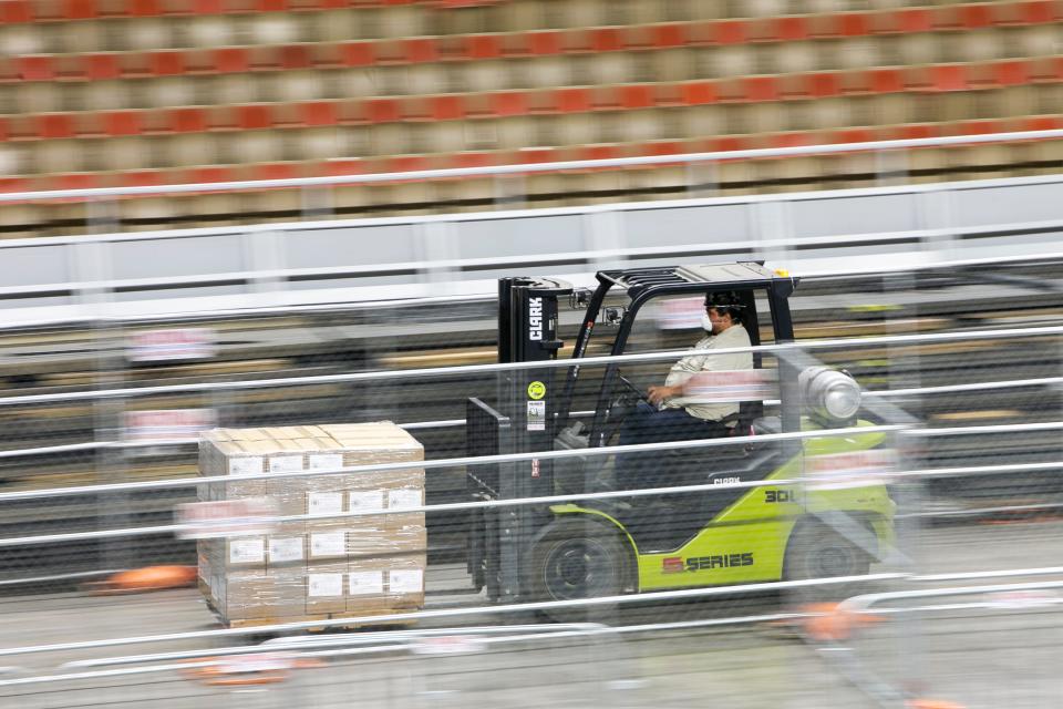 Ballots from the Maricopa County 2020 elections arrive at the Arizona Veterans Memorial Coliseum to be recounted in Phoenix on April 22, 2021.