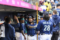 Seattle Mariners' J.P. Crawford (3) holds a trident after his two-run home run against the Oakland Athletics during the fifth inning of a baseball game Tuesday, May 23, 2023, in Seattle. (AP Photo/Caean Couto)