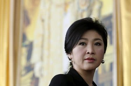 FILE PHOTO: Ousted former Thai Prime Minister Yingluck Shinawatra arrives at the criminal court in Bangkok, Thailand, September 29, 2015. REUTERS/Chaiwat Subprasom/File Picture