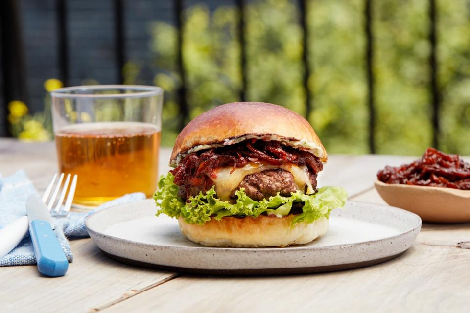 Steakburger with Tangy Caramelized Onions and Herb Butter