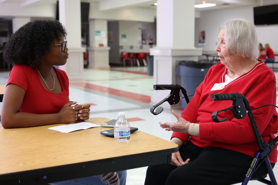 Jayla Worrell interviews Marge Masterman, the valedictorian of her class, at a reunion for the Leon High School class of 1951 Saturday, Sept. 17, 2022.