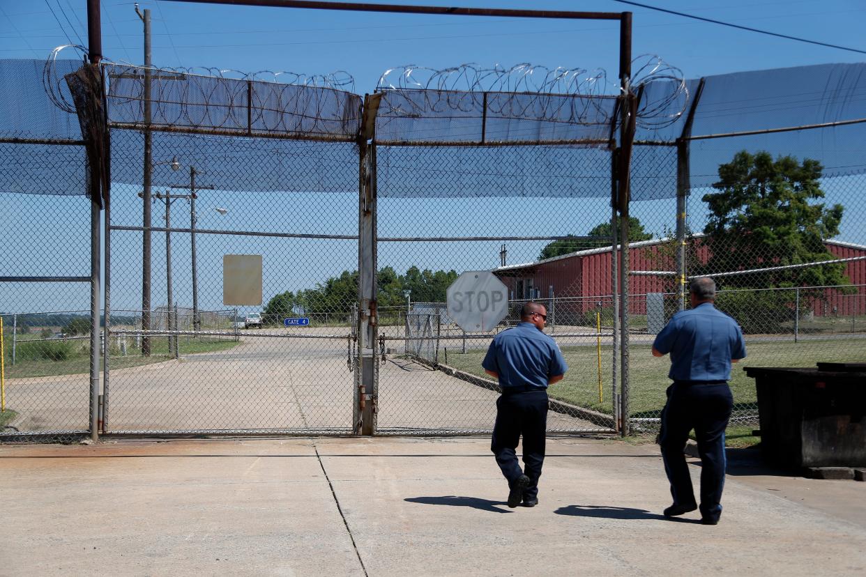 Guards prepare to open a gate at the Eddie Warrior Correctional Center in Taft in August 2016.