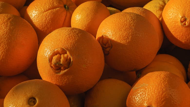 Closeup of several navel oranges