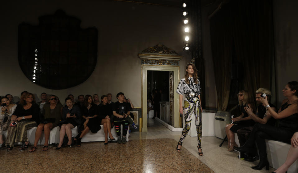 A model wears a creation for Emilio Pucci women's Spring-Summer 2014 collection, part of the Milan Fashion Week, unveiled in Milan, Italy, Saturday, Sept. 21, 2013. (AP Photo/Luca Bruno)