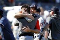 Houston Astros starting pitcher Cristian Javier, back to camera, receives a hug from pitcher Justin Verlander, right after a combined no-hitter against the New York Yankees, Saturday, June 25, 2022, in New York. The Astros won 3-0. (AP Photo/Noah K. Murray)