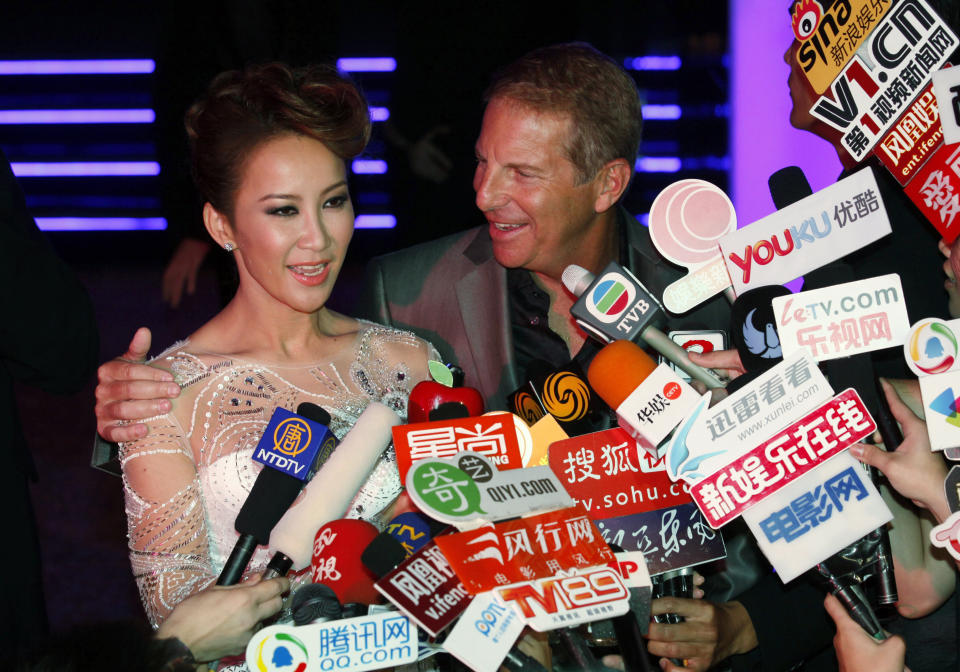 FILE - Hong Kong's pop diva Coco Lee and her husband, Bruce Rockowitz, president of Li & Fung Ltd, speak to media during their wedding banquet at Shaw Studio in Hong Kong Friday, Oct. 28, 2011. Coco Lee, a Hong Kong-born singer who had a highly successful career in Asia, died on Wednesday, July 5, 2023. She was 48. (AP Photo/Kin Cheung, File)
