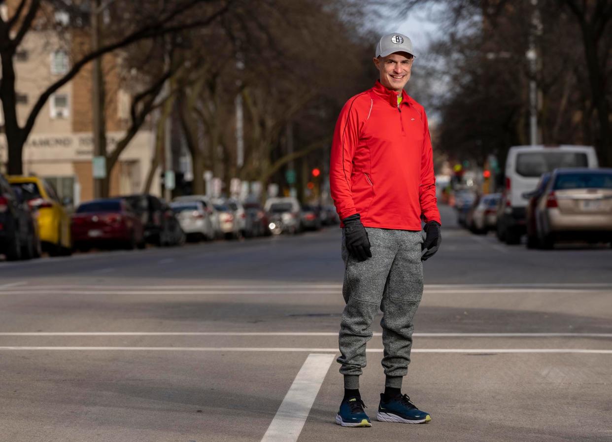 Chris Ponteri, of Wauwatosa, stands near East Curtis Place and North Prospect Avenue, in Milwaukee on Sunday, Nov. 20, 2022, where he finished his quest on Nov. 17 to run every down every street in the city of Milwaukee.