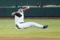 Jun 21, 2018; Omaha, NE, USA; Florida Gators left fielder Austin Langworthy (44) throws to second base to complete a double play to end the fourth inning against the Texas Tech Red Raiders in the College World Series at TD Ameritrade Park. Mandatory Credit: Steven Branscombe-USA TODAY Sports