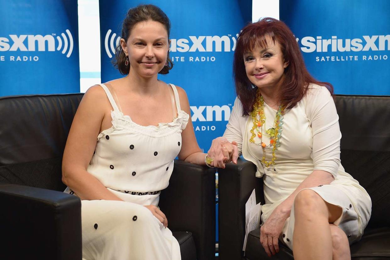 Ashley Judd (L) and mother, singer Naomi Judd pose following the launch of Naomi's SiriusXM series 