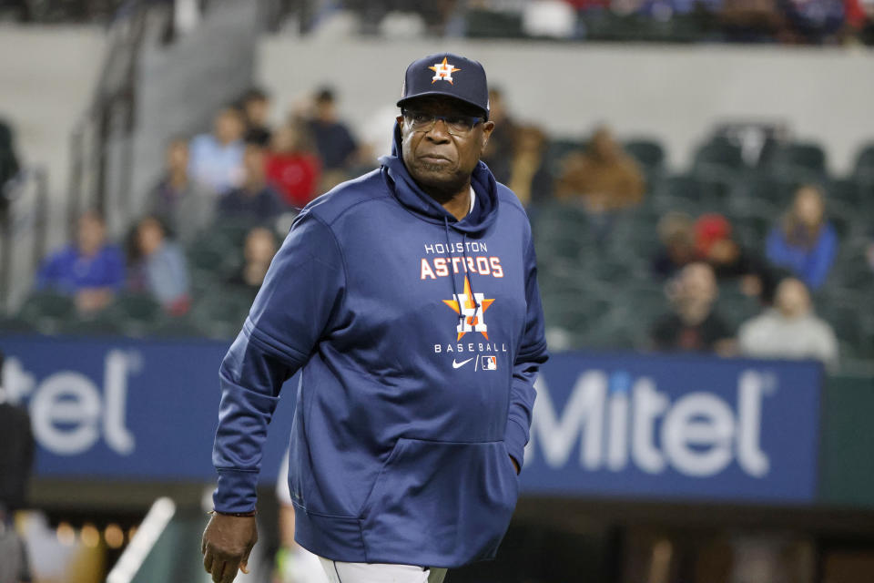 Houston Astros manager Dusty Baker Jr. (12) walks off the field after making a pitching change as the team played the Texas Rangers during the seventh inning of a baseball game Monday, April 25, 2022, in Arlington, Texas. (AP Photo/Michael Ainsworth)