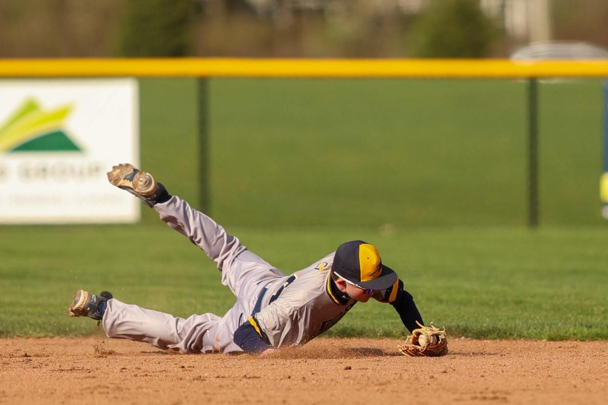 Streetsboro's Jack Pincoe, shown making a diving stop of a line drive against Field, is a top-notch fielder and pitcher for the Rockets.