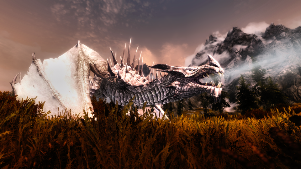 Best Skyrim mods — an ice-white dragon breathes a jet of frost.