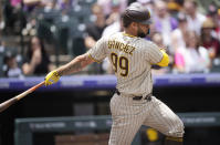 San Diego Padres' Gary Sanchez follows the flight of his RBI-single off Colorado Rockies starting pitcher Kyle Freeland in the first inning of a baseball game Saturday, June 10, 2023, in Denver. (AP Photo/David Zalubowski)