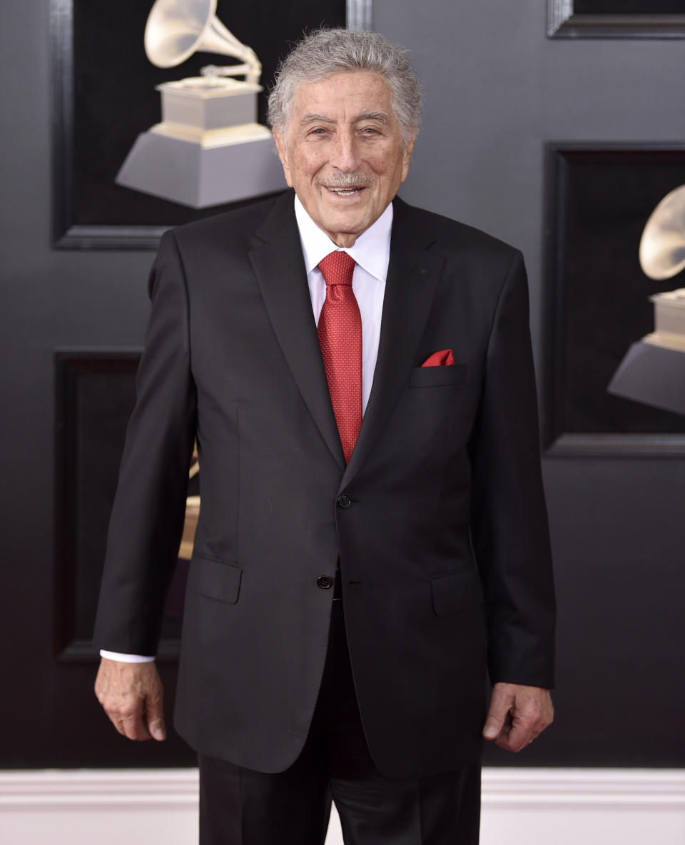 FILE - Tony Bennett arrives at the 60th annual Grammy Awards in New York on Jan. 28, 2018. Bennett has been diagnosed with Alzheimer’s disease but the diagnosis hasn’t quieted his legendary voice. The singer’s wife and son reveal in the latest edition of AARP The Magazine that Bennett was first diagnosed in 2016. The magazine says he endures “increasingly rarer moments of clarity and awareness.”(Photo by Evan Agostini/Invision/AP, File)