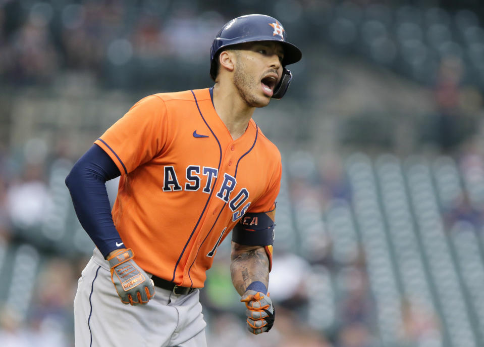 Houston Astros' Carlos Correa (1) reacts after hitting a solo home run during the sixth inning to break s 2-2 tie with the Detroit Tigers during the second baseball game of a doubleheader Saturday, June 26, 2021, in Detroit. (AP Photo/Duane Burleson)