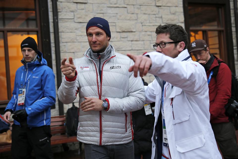 Norway's Aksel Lund Svindal, centre, gestures during a media briefing in the Rosa Khutor ski resort in Krasnaya Polyana, Russia at the Sochi 2014 Winter Olympics, Monday, Feb. 17, 2014. Svindal is leaving the Olympics because he has problems with allergies and fatigue, the Norwegian men's Alpine skiing coach said Monday. (AP Photo/Christophe Ena)