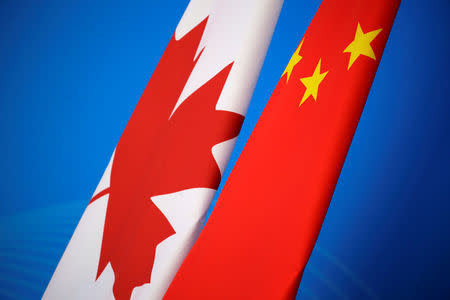 Flags of Canada and China are placed for the first China-Canada economic and financial strategy dialogue in Beijing, China, November 12, 2018. REUTERS/Jason Lee/Pool/Files