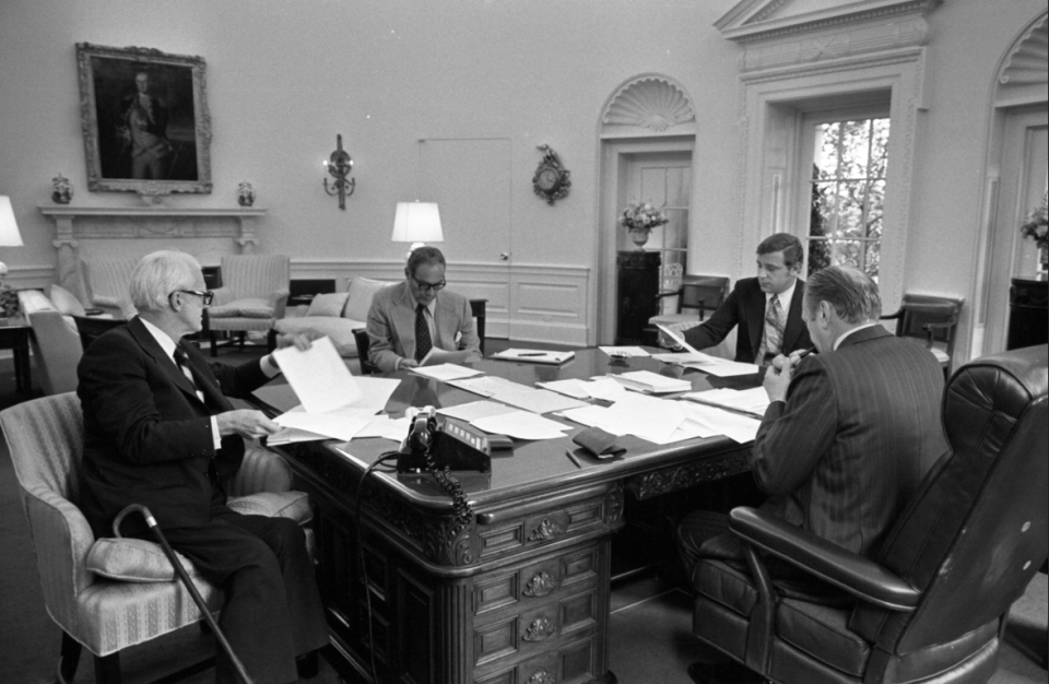 Attorney Benton Becker, far right, discusses his research on a Richard Nixon pardon with President Ford, Al Haig and Philip Buchen.