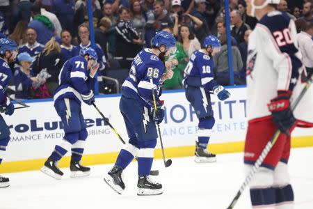 Apr 10, 2019; Tampa, FL, USA; Tampa Bay Lightning right wing Nikita Kucherov (86) and center J.T. Miller (10) and center Anthony Cirelli (71) skate off the ice after losing to Columbus Blue Jackets of game one of the first round of the 2019 Stanley Cup Playoffs at Amalie Arena. Mandatory Credit: Kim Klement-USA TODAY Sports