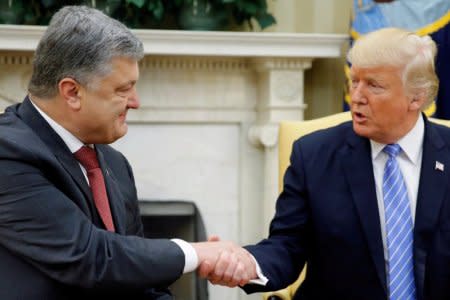 FILE PHOTO: U.S. President Donald Trump shakes hands with Ukraine's President Petro Poroshenko in the Oval Office at the White House in Washington, U.S., June 20, 2017.  REUTERS/Jonathan Ernst/File Photo