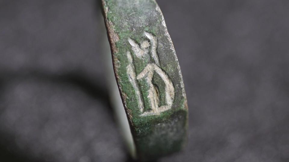  A close-up of a ring with markings on it. 
