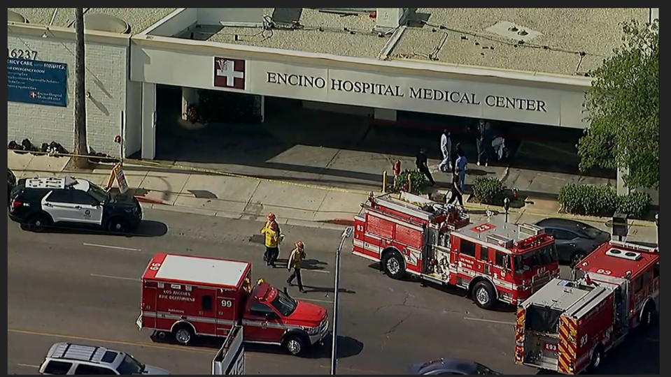This aerial image taken from video provided by ABC7 Los Angeles shows emergency personnel outside the the Encino Hospital Medical Center where a suspect has stabbed multiple people and barricaded himself in the hospital in Encino, Calif., Friday, June 3, 2022. (ABC7 Los Angeles via AP)