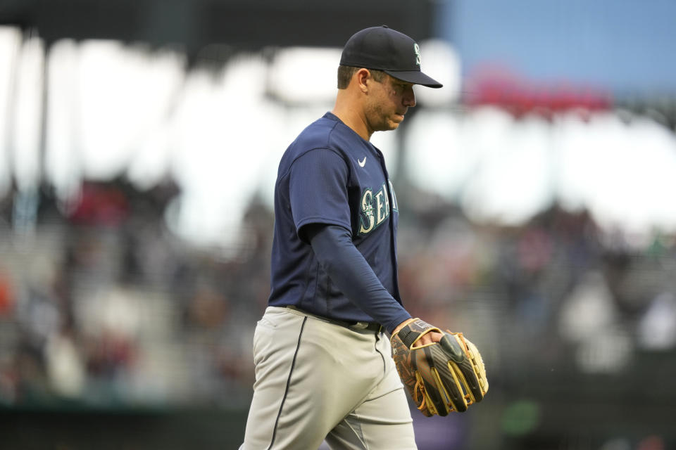 Seattle Mariners starting pitcher Tommy Milone walks to the dugout after being removed in the fifth inning of a baseball game against the San Francisco Giants in San Francisco, Wednesday, July 5, 2023. (AP Photo/Eric Risberg)