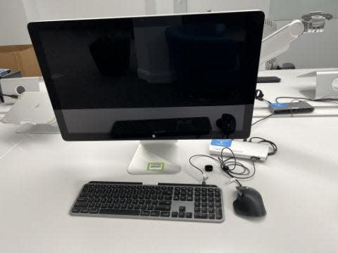 An Apple desktop with a monitor, keyboard and mouse