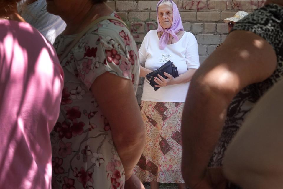 People wait in line for food being distributed by World Central Kitchen on June 08, 2022 in Kramatorsk, Ukraine. There are very few stores or restaurants still open in the city as many residents have fled as the front line of the war continues to edge closer.