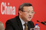 Chinese Vice Commerce Minister and Deputy China International Trade Representative Wang Shouwen attends a news conference in Beijing