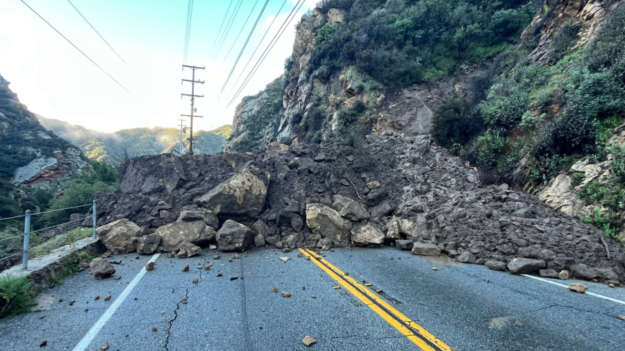 Dirt and boulders covering Malibu Canyon Road are seen in an image posted by the Los Angeles County Fire Department on Feb. 21, 2023.