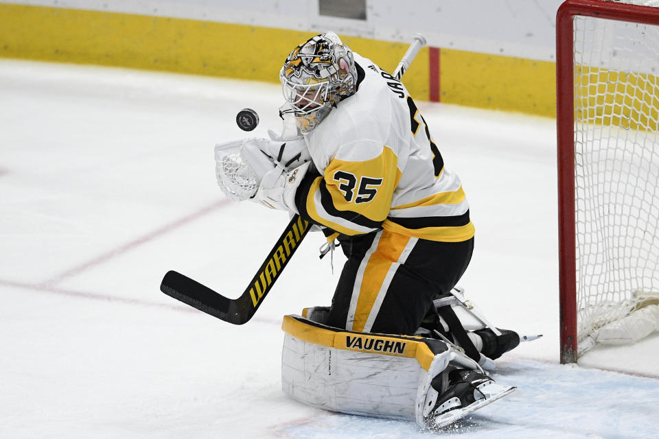 Pittsburgh Penguins goaltender Tristan Jarry stops the puck during the second period of the team's NHL hockey game against the Washington Capitals, Saturday, May 1, 2021, in Washington. (AP Photo/Nick Wass)