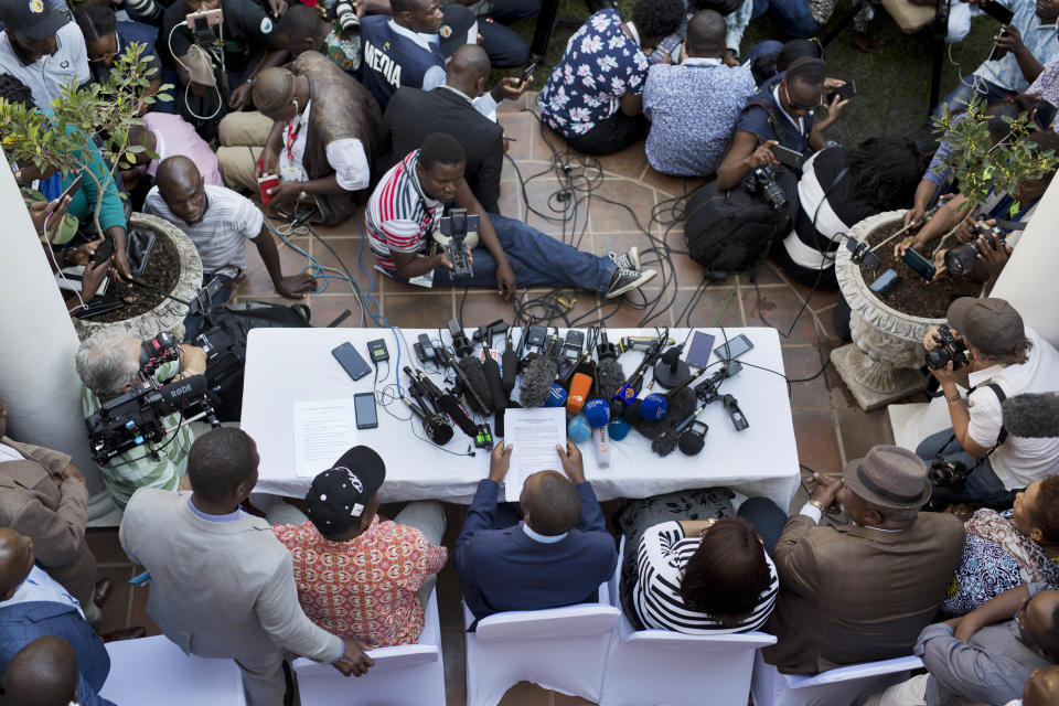 A press conference by opposition leader Nelson Chamisa gets underway in Harare, Zimbabwe, Friday Aug. 3, 2018. Hours after President Emmerson Mnangagwa was declared the winner of a tight election, riot police disrupted the press conference where opposition leader Nelson Chamisa was about to respond to the election results. (AP Photo/Jerome Delay)