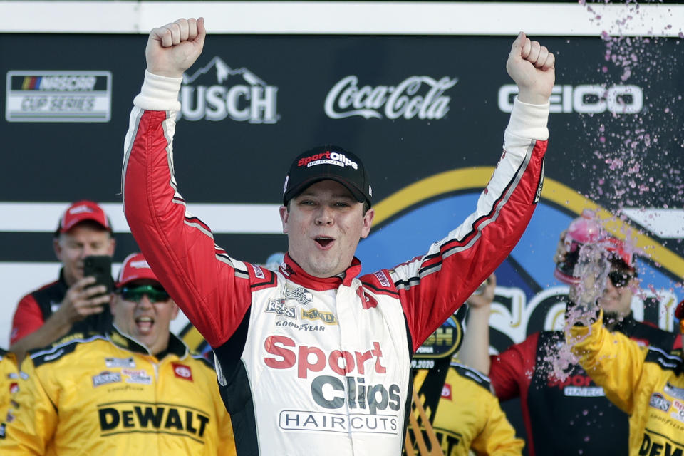 FILE - In this Feb. 9, 2020, file photo, Erik Jones celebrates in Victory Lane after winning the NASCAR Busch Clash auto race at Daytona International Speedway in Daytona Beach, Fla. The pandemic only accelerated the inevitable: The driver market bubble, pushed to its limit with multi-million dollar salaries for nearly two decades, is about to burst. A major reset has arrived and team owners have all the power. They can pick and choose between drivers who bring sponsorship dollars (Bubba Wallace) or drivers who have won races (Erik Jones). (AP Photo/John Raoux, FIlre)